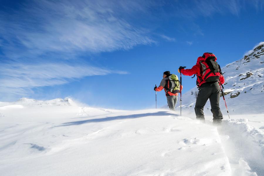 Two men trekking in powder snow