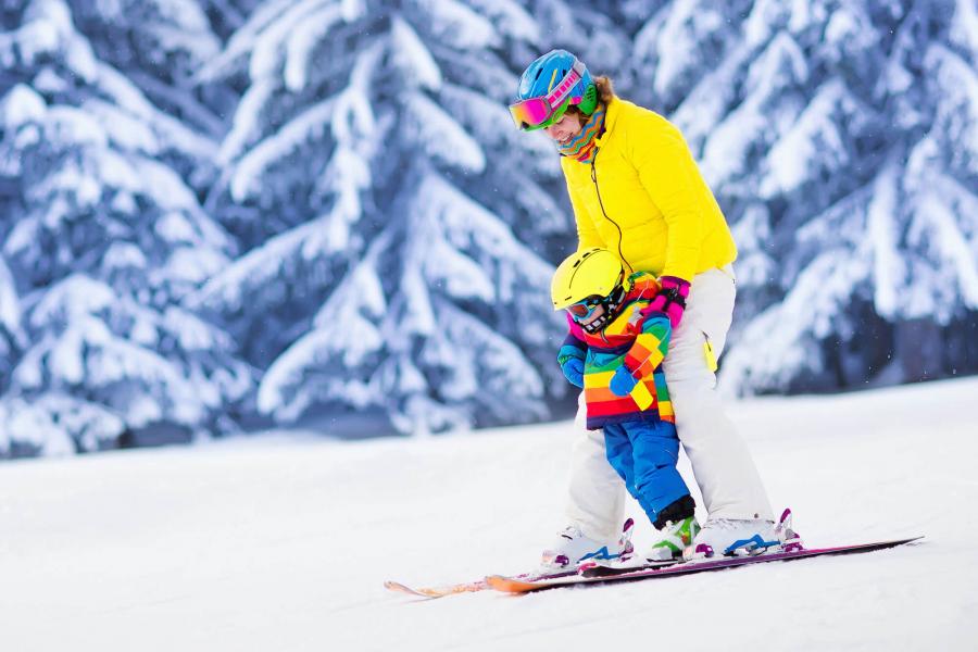 Ski instructor with child